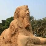 5-Day Cairo and Luxor Tour - Egypt Alabaster Sphinx of Memphis in Egypt, carved from stone with a pharaoh’s face and lion’s body surrounded by palm trees.