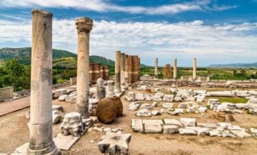 Ancient ruins of stone columns and scattered marble remains at the Basilica of St. John in Selçuk, Turkey.
