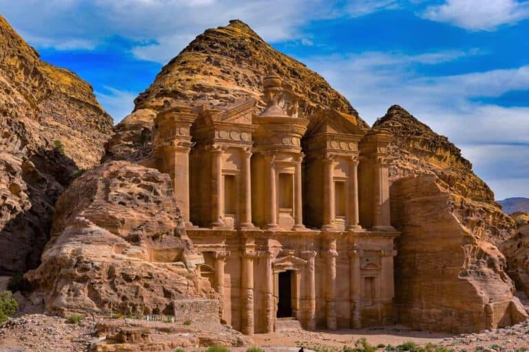 How to Visit Petra from Amman: Day Trip or Overnight Stay? 2 The Monastery in Petra, Jordan, carved into sandstone cliffs with towering columns and detailed Nabatean architecture.