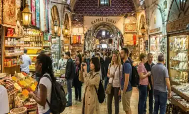 Diverse group of international tourists, including Black, Asian, and European women, exploring the historic streets and shopping for colorful lanterns at the Grand Bazaar in Istanbul.