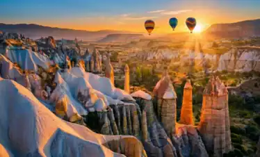 Scenic sunrise over fairy chimneys and hot air balloons for private Cappadocia tour from Istanbul