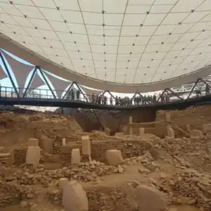Aerial view of the ancient T-shaped pillars at the Gobeklitepe archaeological site, the world's oldest temple, featured on a premium guided day tour from Istanbul.