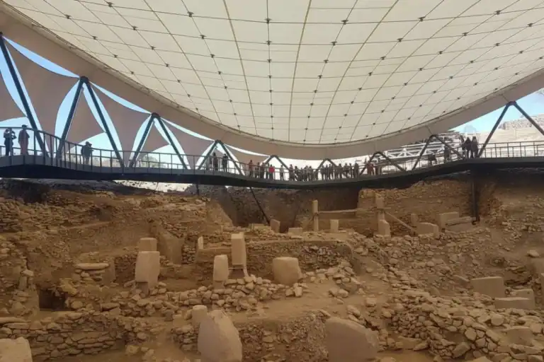 Aerial view of the ancient T-shaped pillars at the Gobeklitepe archaeological site, the world's oldest temple, featured on a premium guided day tour from Istanbul.
