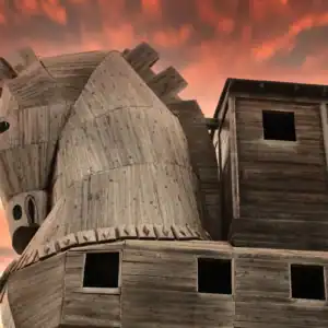 Wooden Trojan Horse replica at ancient Troy beneath a vivid orange sunset, highlighting the legendary historic landmark.